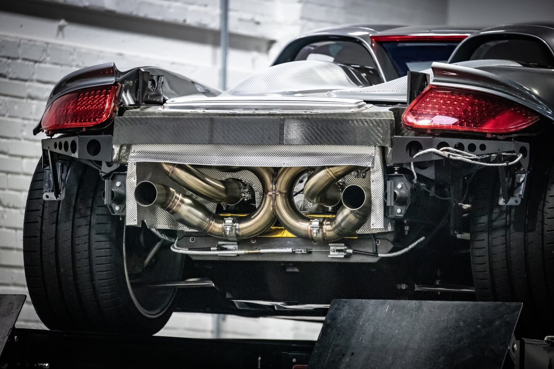 Close-up of Carrera GT exhaust fabrication work at Repasi Motorwerks