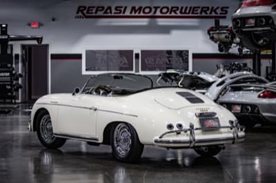 White Porsche 356 Speedster with Carrera GT in background at Repasi Motorwerks