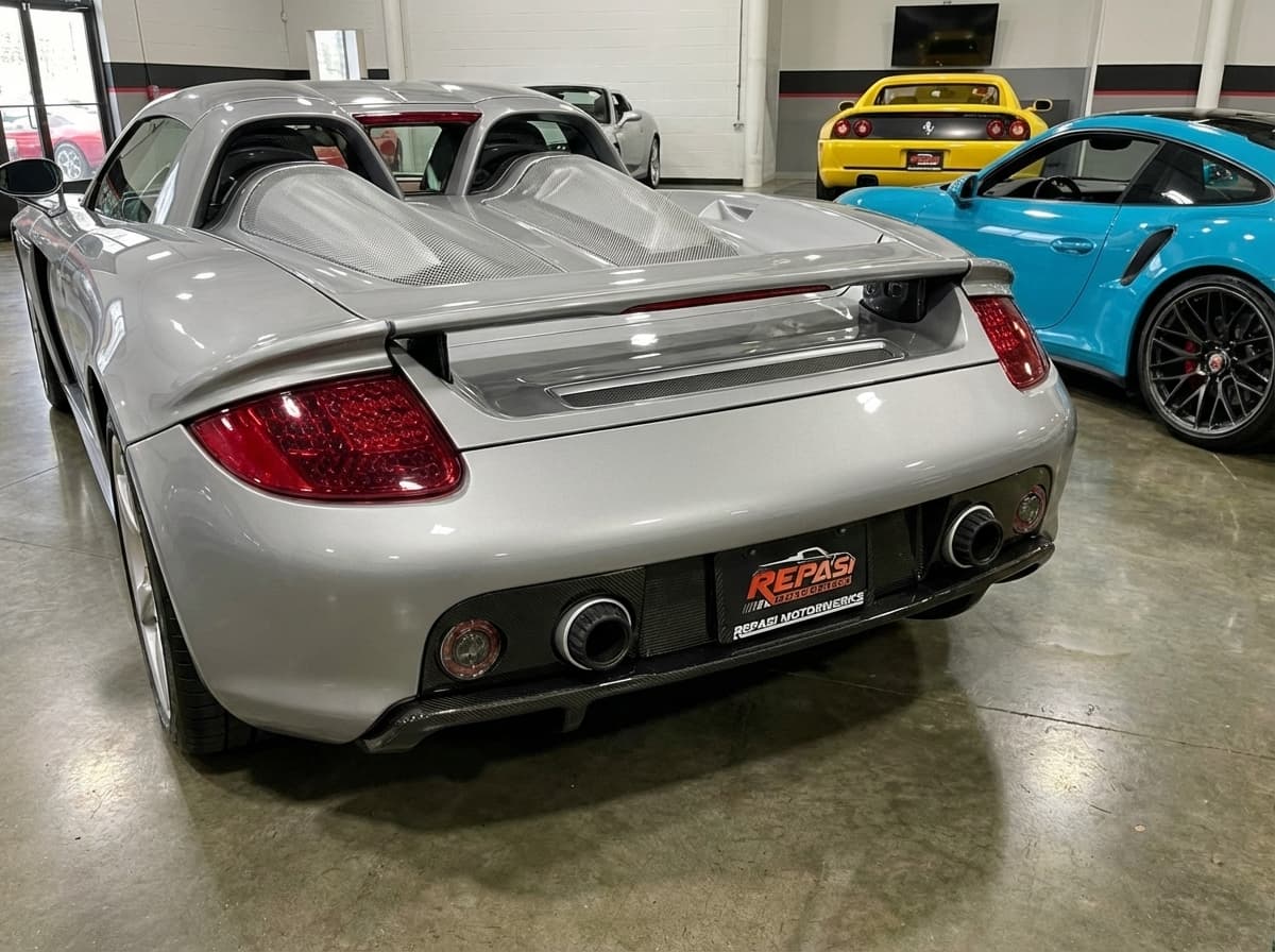 Carbon fiber license plate frame on silver Porsche Carrera GT