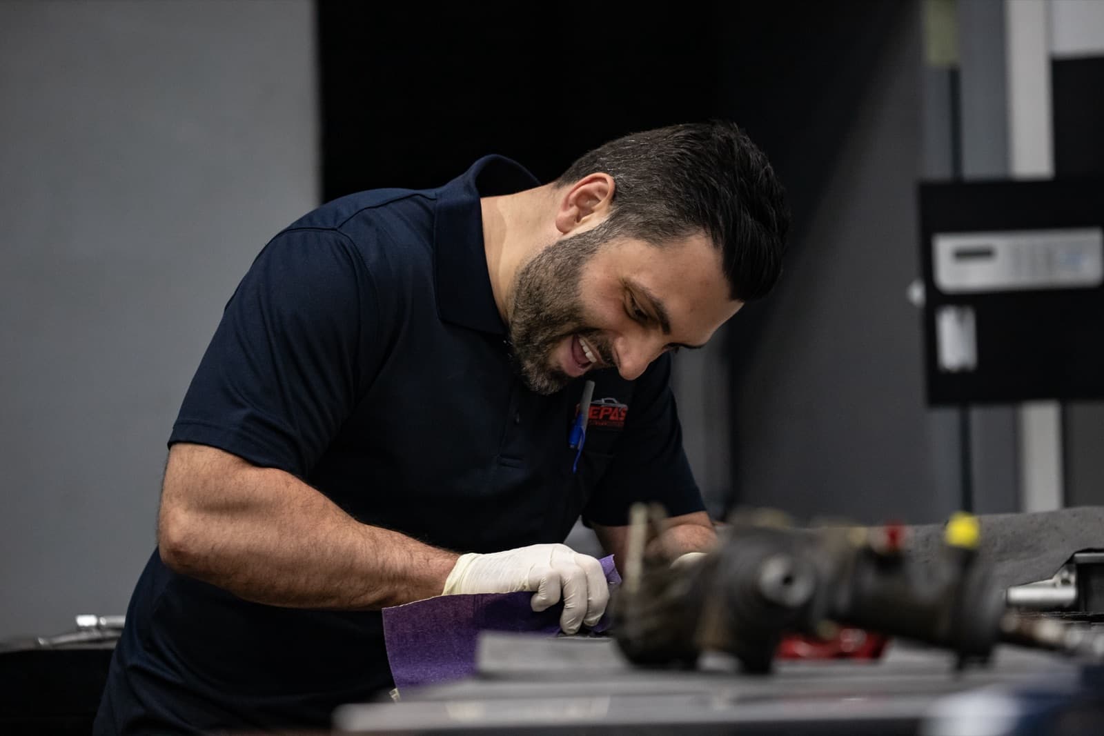 Technician working on Porsche transmission and clutch components