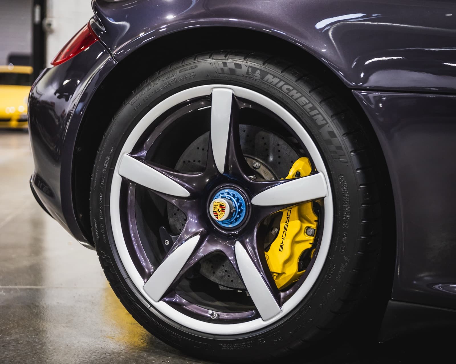 Porsche PCCB ceramic brake caliper closeup