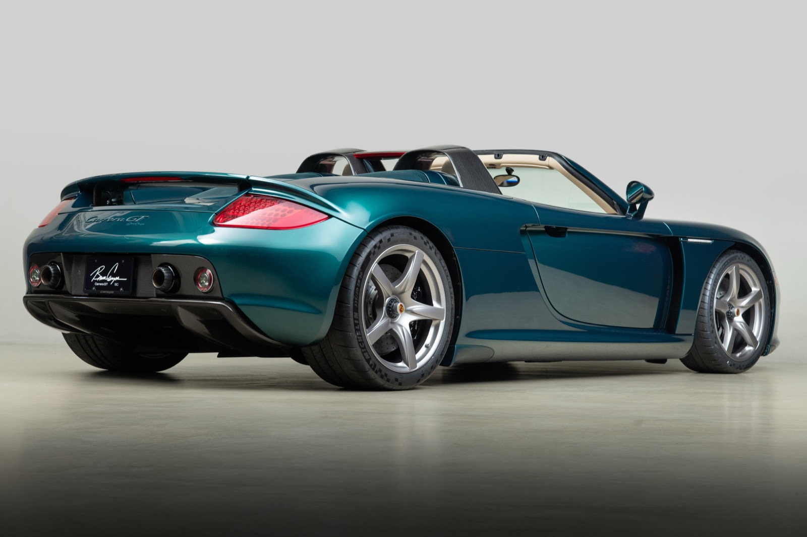 Rear three-quarter view of Canepa Carrera GT SC #01 in Liquid Metal Green